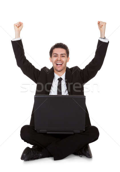 örömteli üzletember ujjongás laptop izolált fehér Stock fotó © AndreyPopov