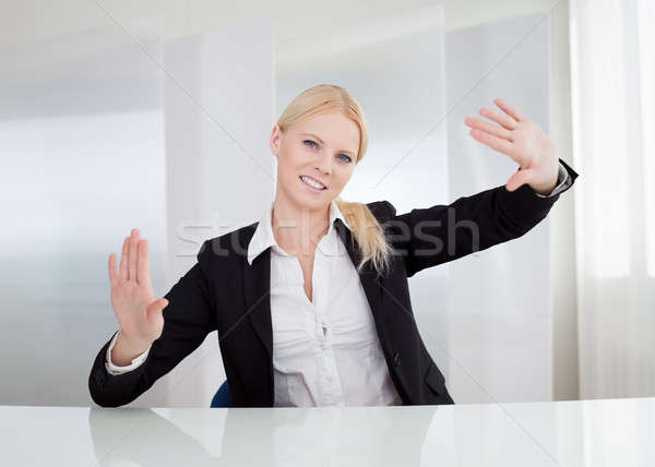 Business woman touching the screen with her finger Stock photo © AndreyPopov