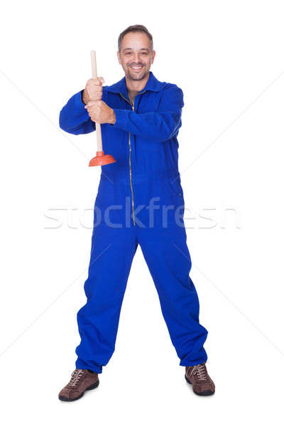 Happy Plumber Holding Plunger Stock photo © AndreyPopov