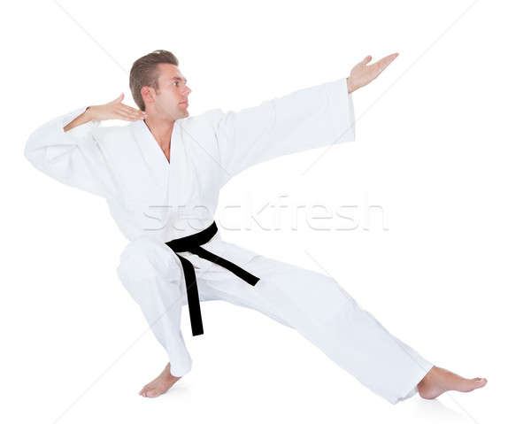 Young Man Practicing Karate Stock photo © AndreyPopov