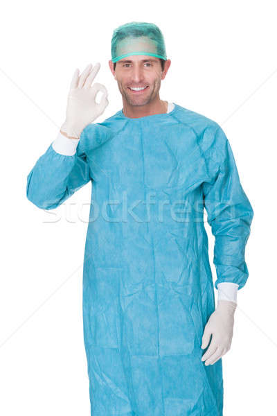 Male surgeon in scrubs uniform making Okay gesture Stock photo © AndreyPopov