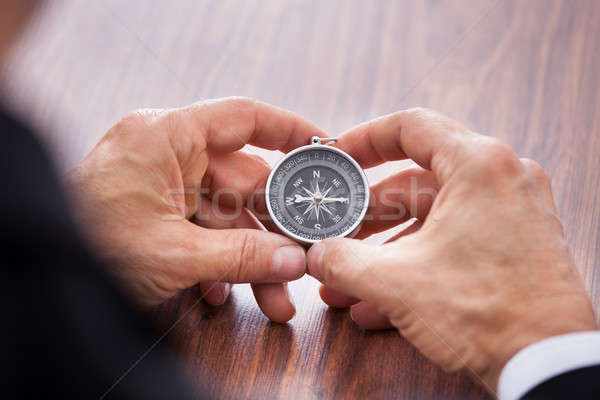 Foto stock: Mano · brújula · primer · plano · blanco · negocios