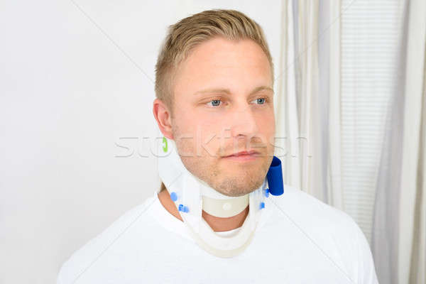 Young Man Wearing Cervical Collar Stock photo © AndreyPopov