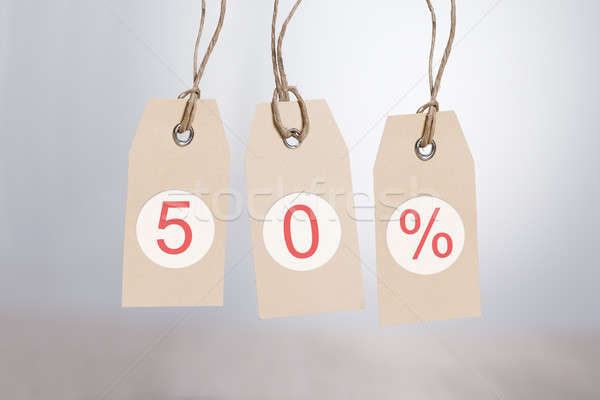 50 réduction suspendu gris papier Photo stock © AndreyPopov