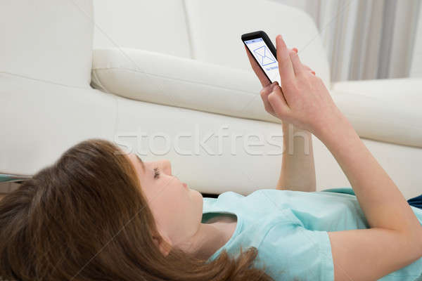 Girl With Mobile Phone Stock photo © AndreyPopov