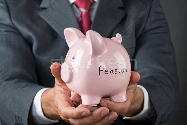 Biznesmen banku piggy emerytura napisany biuro Zdjęcia stock © AndreyPopov