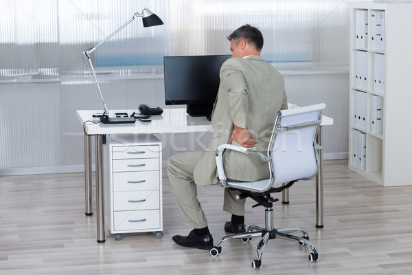 Biznesmen cierpienie ból w krzyżu krzesło widok z tyłu biuro Zdjęcia stock © AndreyPopov