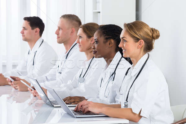 Doctors Using Laptop In Meeting Stock photo © AndreyPopov