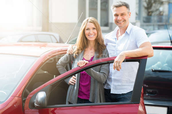 Happy Couple With New Red Car Stock photo © AndreyPopov