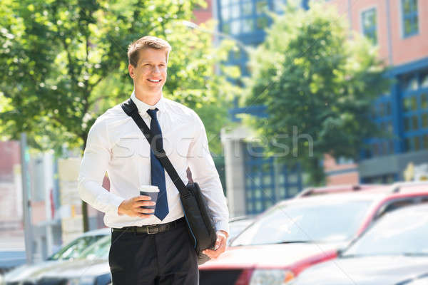 Young Businessman With Disposal Cup Stock photo © AndreyPopov