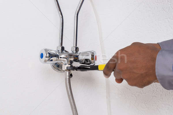 Worker's Hand Repairing Electric Boiler Stock photo © AndreyPopov