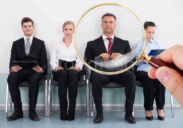 Stock photo: Magnifying Glass Selecting The Best Candidate For The Job