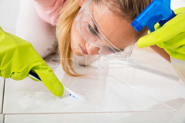 Stressed Woman Removing Stain On The Floor Stock photo © AndreyPopov