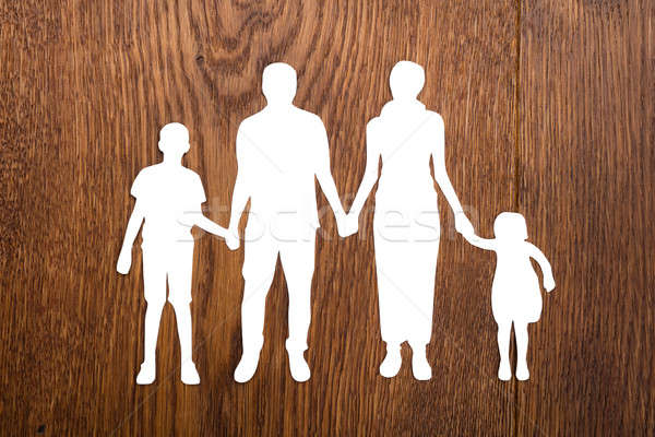 Stock photo: Family Papercut On Wooden Desk