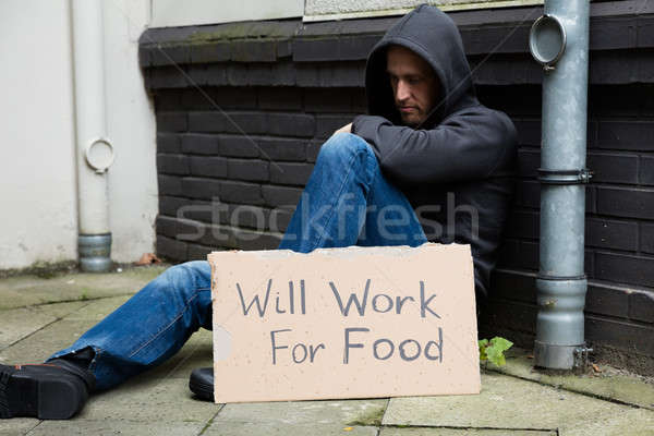 Stock photo: Sad Man With Signboard