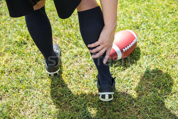 Amerikai futballista fájdalom alsó láb mező Stock fotó © AndreyPopov
