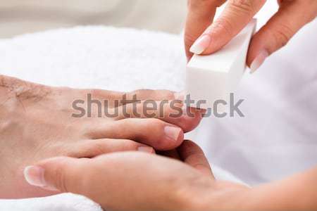 Nő gyantázás szépségszalon terapeuta láb viasz Stock fotó © AndreyPopov