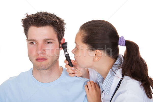 Doctor Examining Patient's Ear Stock photo © AndreyPopov