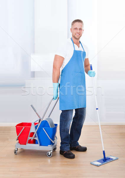 Janitor cleaning wooden floors Stock photo © AndreyPopov