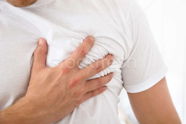 Człowiek cierpienie piersi ból strony Zdjęcia stock © AndreyPopov