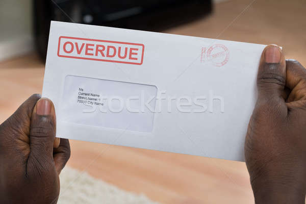 Person Holding Overdue Notice Stock photo © AndreyPopov