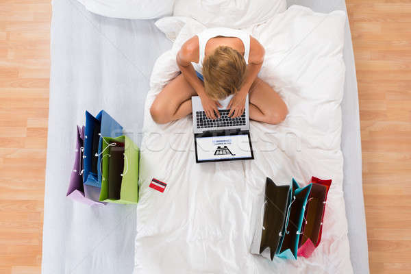 Woman Doing Online Shopping On Laptop Stock photo © AndreyPopov