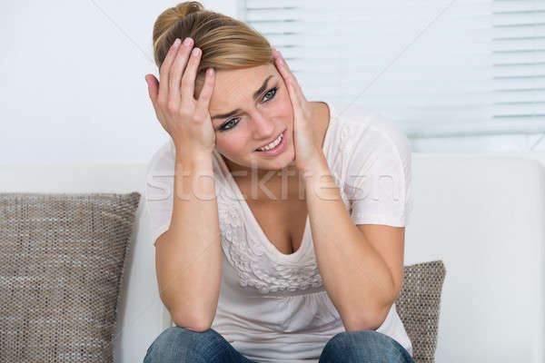 Woman Suffering From Headache At Home Stock photo © AndreyPopov