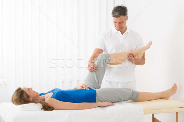 Woman Receiving Leg Massage In Spa Stock photo © AndreyPopov