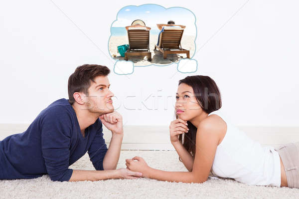 Couple Thinking Of Spending Vacation On Beach Stock photo © AndreyPopov