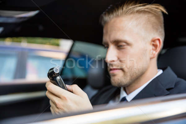 Man Looking At Breathalyzer Test Stock photo © AndreyPopov