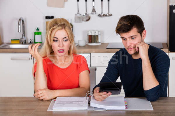 Worried Couple Calculating Their Bills Stock photo © AndreyPopov