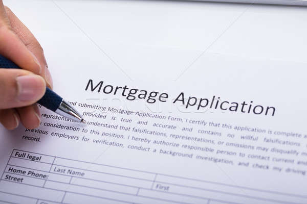 Stock photo: Person Filling Mortgage Application Form