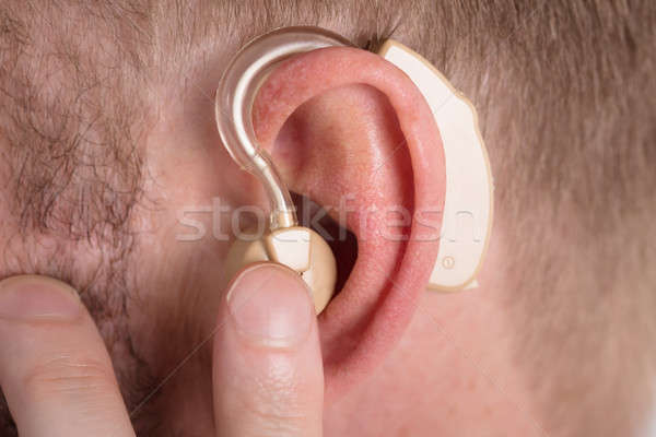 Hombre audífono primer plano medicina ayudar Foto stock © AndreyPopov
