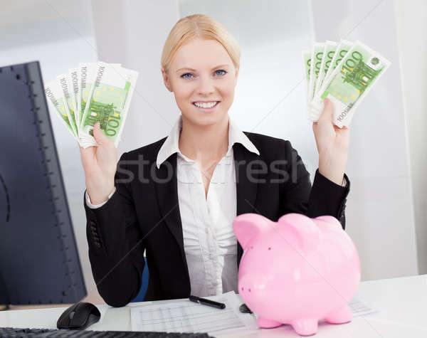 Businesswoman holding euro currency notes Stock photo © AndreyPopov