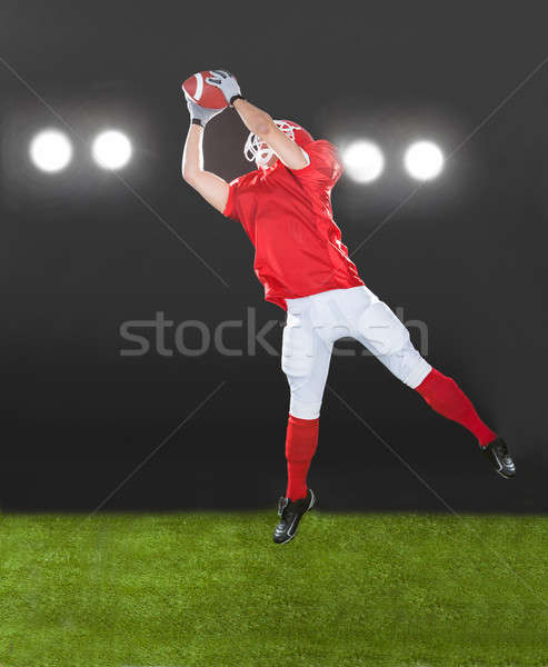 American Football Player Jumping On Field Stock photo © AndreyPopov