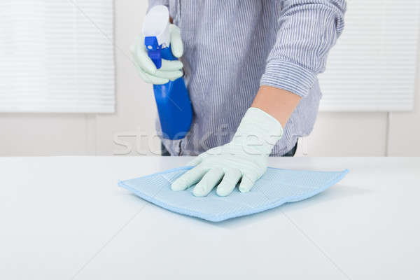 Woman's Hand Wiping Table With Rag Stock photo © AndreyPopov
