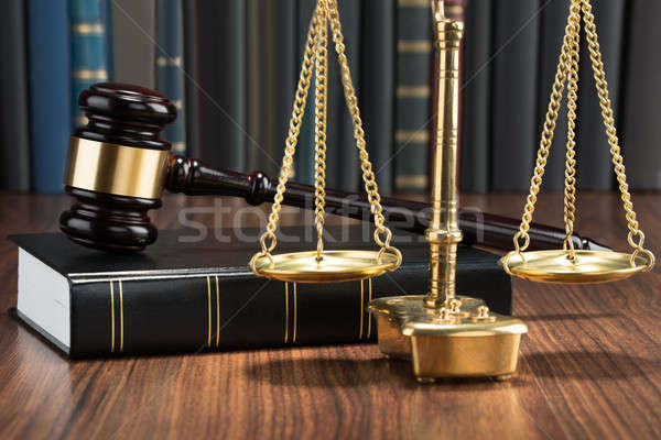 Stock photo: Gavel On Book With Golden Scale
