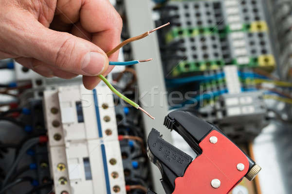 Stock photo: Technician Holding Cables And Work Tool