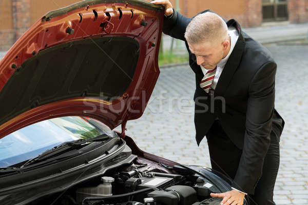 Man Watching The Engine Of A Car Stock photo © AndreyPopov