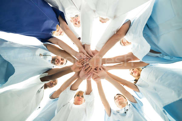 Több nemzetiségű orvosi csapat kezek közvetlenül alatt Stock fotó © AndreyPopov