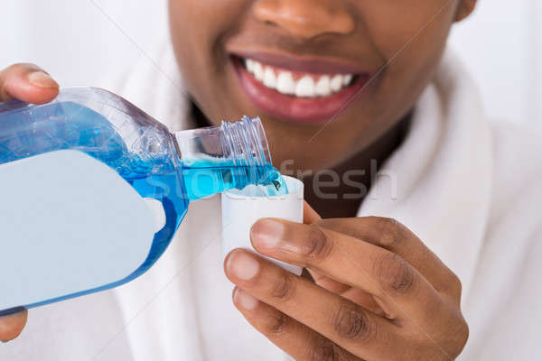 Close-up Of A Woman Pouring Mouth Wash Stock photo © AndreyPopov