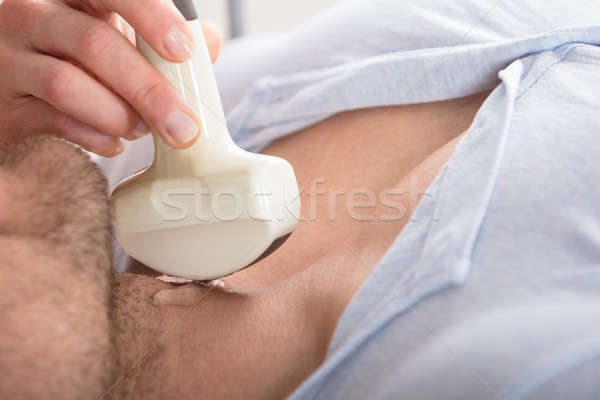 Stock photo: Man Getting Ultrasound Of A Thyroid