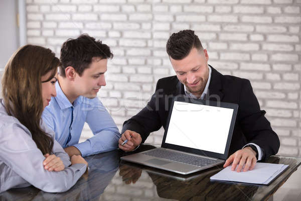 Affaires portable couple souriant bureau [[stock_photo]] © AndreyPopov