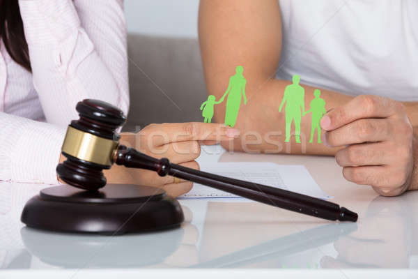 Man And Woman Holding Family Figure Cut Out Stock photo © AndreyPopov