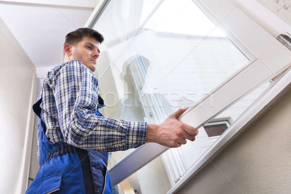 Male Repairman Installing Window Stock photo © AndreyPopov