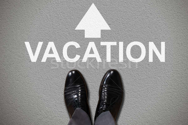 Stock photo: Human Foot With Vacation Text And Arrow Sign