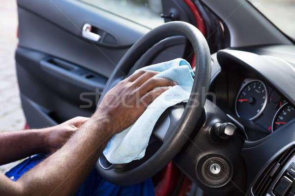 Worker Cleaning Car Steering Wheel Stock photo © AndreyPopov