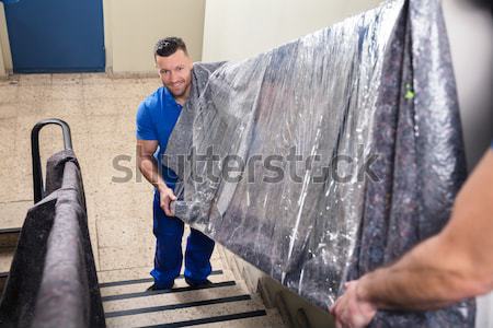Kettő hordoz bútor lépcsőház fiatal férfi Stock fotó © AndreyPopov