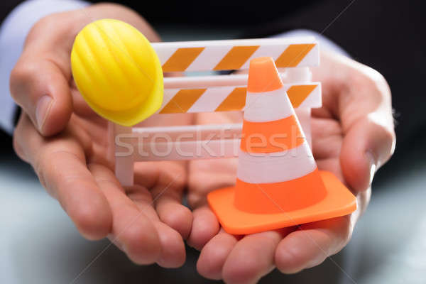 Close-up Of Barricade With Traffic Cone And Hard Hat Stock photo © AndreyPopov