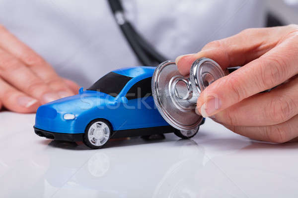 Doctor's Hand Examining Car Stock photo © AndreyPopov